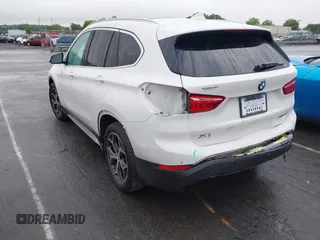 2019 BMW X1 xDrive28i with VIN WBXHT3C54K3H35641, listed as a IAAI auction lot 42241894 with 100,989 mi miles and . Bid and sale history available at DreamBid. Image 3.