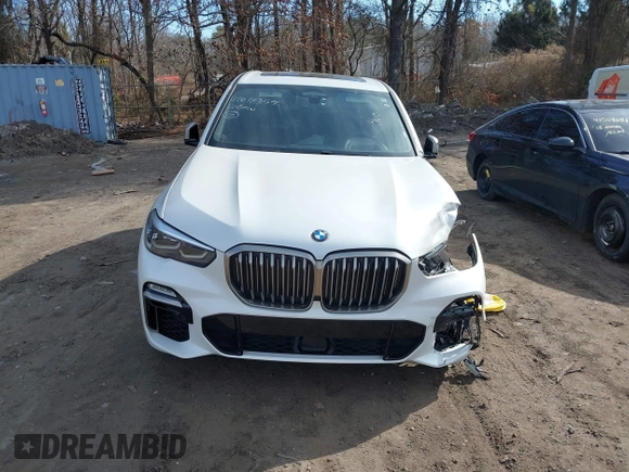 2020 BMW X5 M50i with VIN 5UXJU4C06LLE45651, listed as a IAAI auction lot 41618355 with 70,885 mi miles and . Bid and sale history available at DreamBid. Image 12.