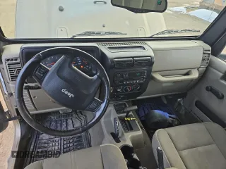 2004 Jeep Wrangler Sahara with VIN 1J4FA59S64P774768, listed as a Copart auction lot 49868895 with 120,800 mi miles and Salvage Title. Bid and sale history available at DreamBid. Image 8.