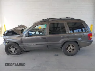 1999 Jeep Grand Cherokee Limited z VIN 1J4GW68N0XC512229, wystawiony jako IAAI lot #42189815 z przebiegiem 230 028 mil mil oraz . Historia ofert i sprzedaży dostępna na DreamBid. Obrazek 15.
