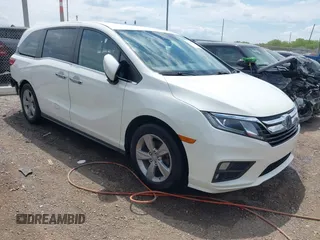 2019 Honda Odyssey EX-L z VIN 5FNRL6H71KB081808, wystawiony jako IAAI lot #42198320 z przebiegiem 129 803 mil mil oraz . Historia ofert i sprzedaży dostępna na DreamBid. Obrazek 1.