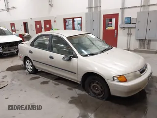 1998 Mazda Protege DX z VIN JM1BC1419W0171802, wystawiony jako IAAI lot #42202861 z przebiegiem 252 304 mil mil oraz . Historia ofert i sprzedaży dostępna na DreamBid. Obrazek 1.
