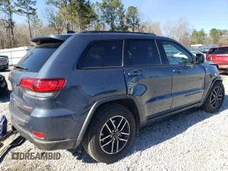 2021 Jeep Grand Cherokee Trailhawk with VIN 1C4RJFLG6MC590810, listed as a Copart auction lot 43708095 with 59,566 mi miles and Salvage Title. Bid and sale history available at carsss.com. Image 3.