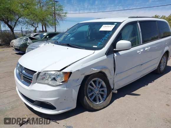 2014 Dodge Grand Caravan SXT with VIN 2C4RDGCG1ER429495, listed as a IAAI auction lot 42058513 with 136,936 mi miles and . Bid and sale history available at DreamBid. Image 2.