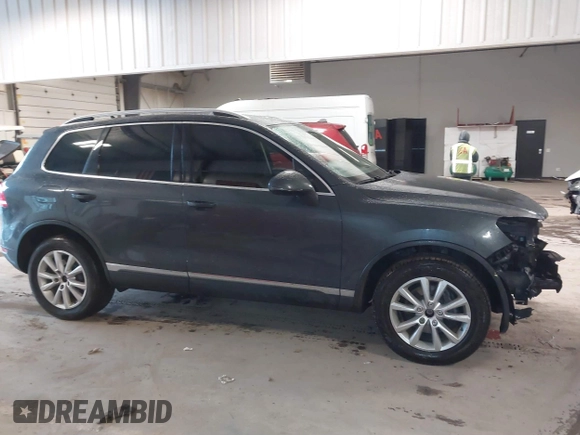 2013 Volkswagen Touareg Lux with VIN WVGEF9BP6DD007032, listed as a IAAI auction lot 41684721 with 147,249 mi miles and . Bid and sale history available at DreamBid. Image 14.