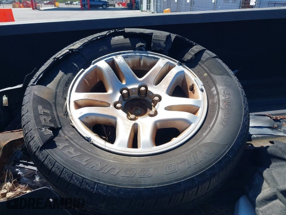 2003 Toyota Tundra SR5 with VIN 5TBRT34143S411690, listed as a IAAI auction lot 41854115 with 200,060 mi miles and . Bid and sale history available at DreamBid. Image 12.