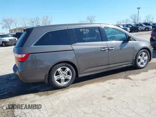 2012 Honda Odyssey Touring with VIN 5FNRL5H9XCB077351, listed as a IAAI auction lot 42045976 with 146,290 mi miles and . Bid and sale history available at DreamBid. Image 4.