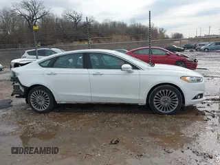 2016 Ford Fusion Titanium with VIN 3FA6P0K96GR158621, listed as a IAAI auction lot 41678349 with 182,162 mi miles. Bid and sale history available at carsss.com. Image 14.