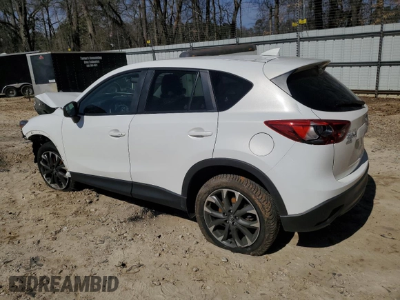 2016 Mazda CX-5 Grand Touring with VIN JM3KE4DY6G0857197, listed as a Copart auction lot 44500955 with 76,088 mi miles and Salvage Title. Bid and sale history available at DreamBid. Image 2.