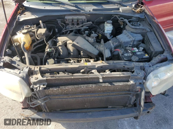 2006 Ford Escape Limited with VIN 1FMYU04116KA40963, listed as a Copart auction lot 61600525 with 208,696 mi miles and Salvage title. Bid and sale history available at DreamBid. Image 12.