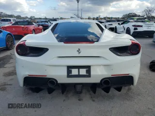 2016 Ferrari 488 z VIN ZFF79ALAXG0216223, wystawiony jako Copart lot #74210804 z przebiegiem Nie podano mil oraz Szkody całkowita. Historia ofert i sprzedaży dostępna na DreamBid. Obrazek 6.