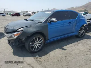 2014 Scion tC z VIN JTKJF5C72E3069652, wystawiony jako Copart lot #59791195 z przebiegiem 178 938 mil mil oraz Szkoda całkowita • Salvage title. Historia ofert i sprzedaży dostępna na DreamBid. Obrazek 1.