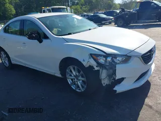 2014 Mazda 6 i Sport with VIN JM1GJ1U58E1105376, listed as a IAAI auction lot 42024402 with 124,233 mi miles. Bid and sale history available at carsss.com. Image 1.