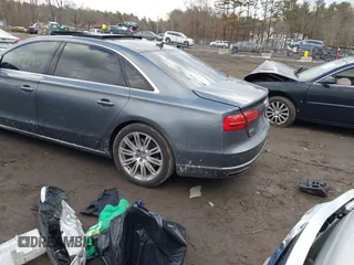 2015 Audi A8 L 4.0T with VIN WAU32AFD4FN041084, listed as a IAAI auction lot 41450453 with 86,199 mi miles. Bid and sale history available at carsss.com. Image 3.