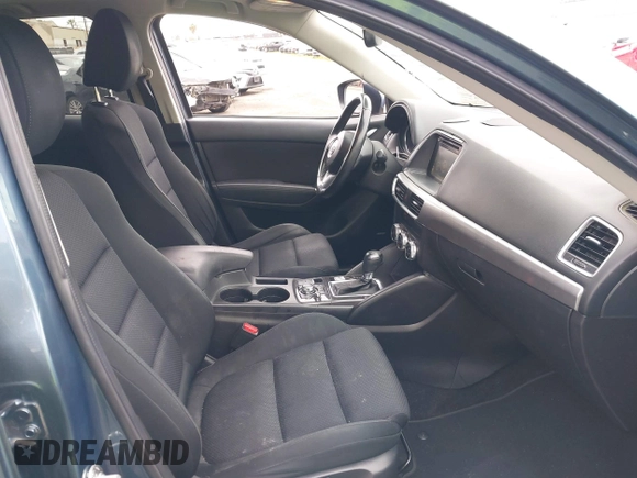 2016 Mazda CX-5 Touring z VIN JM3KE2CY2G0699138, wystawiony jako IAAI lot #42153228 z przebiegiem 144 191 mil mil oraz . Historia ofert i sprzedaży dostępna na DreamBid. Obrazek 5.