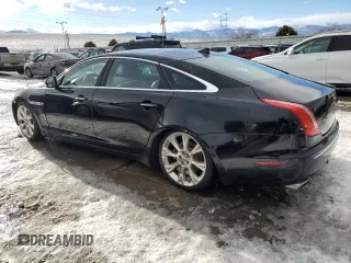 2015 Jaguar XJ Portfolio z VIN SAJWJ2GD4F8V79582, wystawiony jako Copart lot #42121395 z przebiegiem 65 017 mil mil oraz Szkoda całkowita • Salvage title. Historia ofert i sprzedaży dostępna na DreamBid. Obrazek 2.