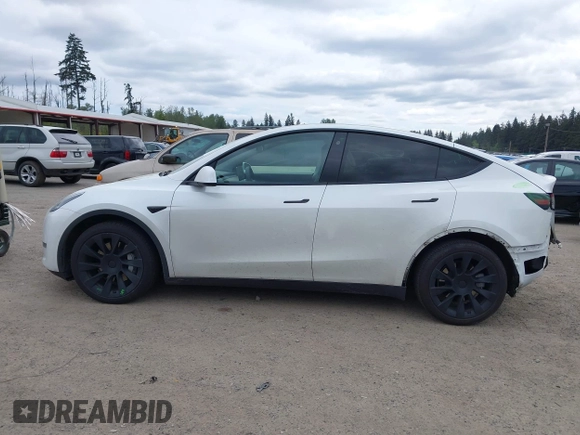 2021 Tesla Model Y Long Range with VIN 5YJYGDEE6MF082883, listed as a IAAI auction lot 42078807 with 64,953 mi miles. Bid and sale history available at carsss.com. Image 15.