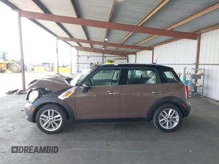 2012 MINI Countryman with VIN WMWZB3C51CWM04563, listed as a IAAI auction lot 42564564 with 95,760 mi miles and . Bid and sale history available at DreamBid. Image 14.