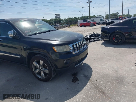 2011 Jeep Grand Cherokee Overland with VIN 1J4RS6GT4BC584029, listed as a IAAI auction lot 42088953 with 144,777 mi miles and . Bid and sale history available at DreamBid. Image 5.