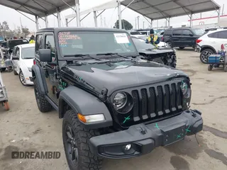 2021 Jeep Wrangler Sport with VIN 1C4GJXAN5MW627228, listed as a IAAI auction lot 42170010 with 56,965 mi miles and . Bid and sale history available at DreamBid. Image 1.