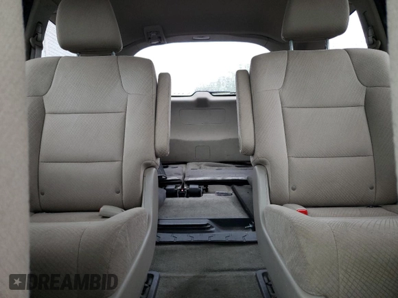 2014 Honda Odyssey LX z VIN 5FNRL5H24EB098072, wystawiony jako Copart lot #57577385 z przebiegiem 215 069 mil mil oraz Szkoda całkowita • Salvage title. Historia ofert i sprzedaży dostępna na DreamBid. Obrazek 10.