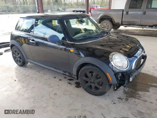 2010 MINI Cooper Hardtop with VIN WMWMF3C57ATZ65458, listed as a IAAI auction lot 41953118 with 106,047 mi miles. Bid and sale history available at carsss.com. Image 1.