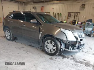 2015 Cadillac SRX Luxury Collection with VIN 3GYFNBE34FS575613, listed as a IAAI auction lot 41697251 with 173,117 mi miles and . Bid and sale history available at DreamBid. Image 1.