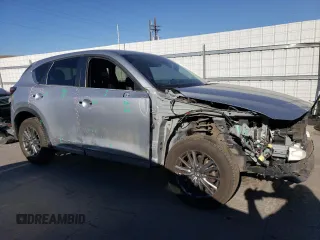 2020 Mazda CX-5 Touring with VIN JM3KFBCM3L0793369, listed as a Copart auction lot 49724385 with 88,470 mi miles and Salvage Title. Bid and sale history available at carsss.com. Image 4.