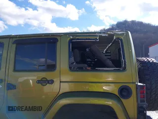 2007 Jeep Wrangler Unlimited Sahara with VIN 1J4GA59187L189519, listed as a IAAI auction lot 41204036 with 165,428 mi miles and . Bid and sale history available at DreamBid. Image 17.