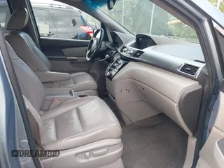 2012 Honda Odyssey EX-L with VIN 5FNRL5H60CB095086, listed as a IAAI auction lot 42251330 with 144,232 mi miles and . Bid and sale history available at DreamBid. Image 5.