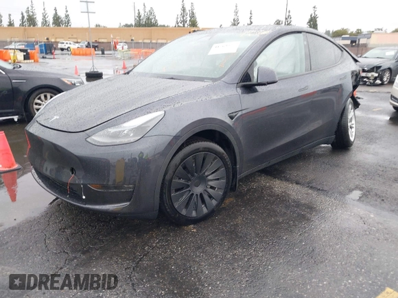 2024 Tesla Model Y Long Range with VIN 7SAYGDEE5RA241433, listed as a IAAI auction lot 41569277 with 7,490 mi miles. Bid and sale history available at carsss.com. Image 2.