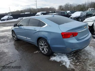 2014 Chevrolet Impala LTZ with VIN 1G1145SL0EU132598, listed as a IAAI auction lot 41264394 with 84,783 mi miles. Bid and sale history available at carsss.com. Image 3.