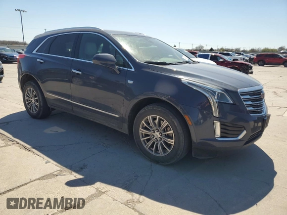 2019 Cadillac XT5 Luxury FWD with VIN 1GYKNCRS1KZ131818, listed as a Copart auction lot 49354595 with 131,995 mi miles and Salvage Title. Bid and sale history available at DreamBid. Image 4.