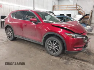 2018 Mazda CX-5 Grand Touring with VIN JM3KFBDM5J0414013, listed as a IAAI auction lot 42013479 with 88,225 mi miles and . Bid and sale history available at DreamBid. Image 1.