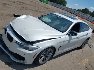 2015 BMW 4 Series 428i with VIN WBA4A5C56FG052023, listed as a IAAI auction lot 40085862 with 90,796 mi miles and . Bid and sale history available at carsss.com. Image 2.