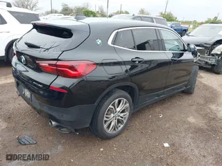 2022 BMW X2 xDrive28i with VIN WBXYJ1C01N5U20171, listed as a IAAI auction lot 41284932 with 64,256 mi miles. Bid and sale history available at carsss.com. Image 4.