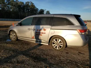 2016 Honda Odyssey Touring Elite with VIN 5FNRL5H92GB010748, listed as a Copart auction lot 48997425 with 145,251 mi miles and Salvage Title. Bid and sale history available at DreamBid. Image 2.