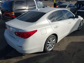 2015 Infiniti Q50 Premium with VIN JN1BV7AP6FM349523, listed as a IAAI auction lot 40940482 with 96,577 mi miles and . Bid and sale history available at DreamBid. Image 4.