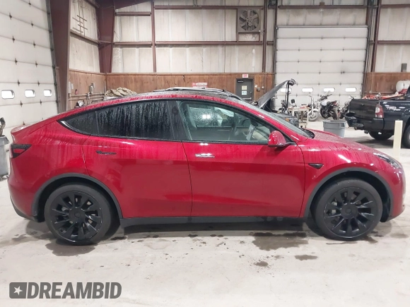 2024 Tesla Model Y Long Range with VIN 7SAYGAEE2RF986206, listed as a IAAI auction lot 42177852 with 14,399 mi miles and . Bid and sale history available at DreamBid. Image 12.