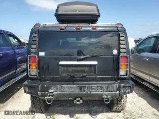 2003 Hummer H2 with VIN 5GRGN23U33H114427, listed as a Copart auction lot 76528834 with 133,571 mi miles and Salvage Title. Bid and sale history available at carsss.com. Image 6.