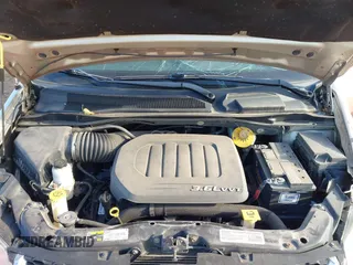 2014 Dodge Grand Caravan SXT with VIN 2C4RDGCG0ER210186, listed as a IAAI auction lot 40813319 with 100,230 mi miles and . Bid and sale history available at DreamBid. Image 10.