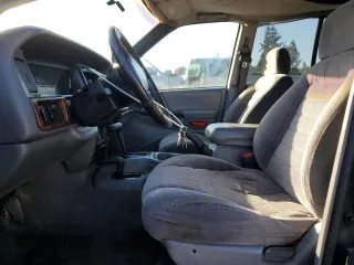 1998 Jeep Grand Cherokee Laredo with VIN 1J4GZ58S0WC106148, listed as a Copart auction lot 42855105 with 263,785 mi miles and Salvage Title. Bid and sale history available at carsss.com. Image 7.