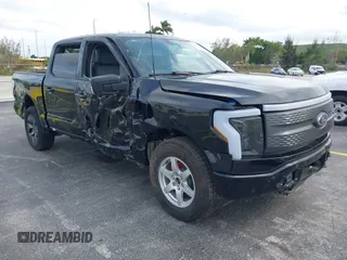2023 Ford F-150 Lightning Pro with VIN 1FTVW1ELXPWG15885, listed as a IAAI auction lot 41631871 with 88,151 mi miles. Bid and sale history available at carsss.com. Image 1.