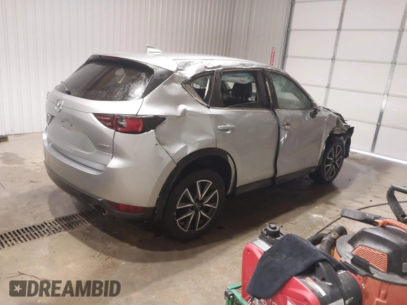 2018 Mazda CX-5 Touring with VIN JM3KFBCM7J0347769, listed as a IAAI auction lot 41611985 with 158,579 mi miles. Bid and sale history available at carsss.com. Image 4.