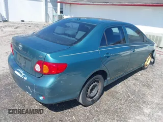 2009 Toyota Corolla with VIN JTDBL40EX99034801, listed as a IAAI auction lot 41943591 with 204,674 mi miles. Bid and sale history available at carsss.com. Image 4.