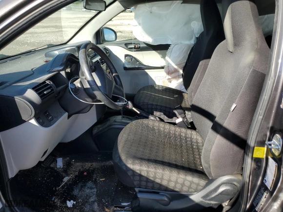 2012 Scion iQ with VIN JTNJJXB0XCJ015980, listed as a Copart auction lot 72237564 with 97,494 mi miles and Salvage Title. Bid and sale history available at carsss.com. Image 7.