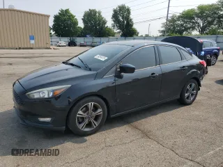 2018 Ford Focus SE z VIN 1FADP3F2XJL228407, wystawiony jako Copart lot #59254415 z przebiegiem 75 241 mil mil oraz Szkoda całkowita • Salvage title. Historia ofert i sprzedaży dostępna na DreamBid. Obrazek 1.
