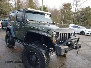 2009 Jeep Wrangler Rubicon with VIN 1J8GA64169L743008, listed as a IAAI auction lot 41792451 with 142,414 mi miles. Bid and sale history available at carsss.com. Image 1.
