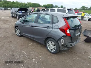 2015 Honda Fit LX z VIN 3HGGK5H59FM714352, wystawiony jako IAAI lot #42156097 z przebiegiem 103 587 mil mil oraz . Historia ofert i sprzedaży dostępna na DreamBid. Obrazek 3.