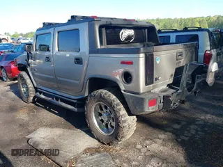 2005 Hummer H2 SUT with VIN 5GRGN22UX5H106653, listed as a IAAI auction lot 42015559 with 180,519 mi miles. Bid and sale history available at carsss.com. Image 3.